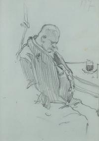 Mężczyzna śpiący za stołem w kawiarni
